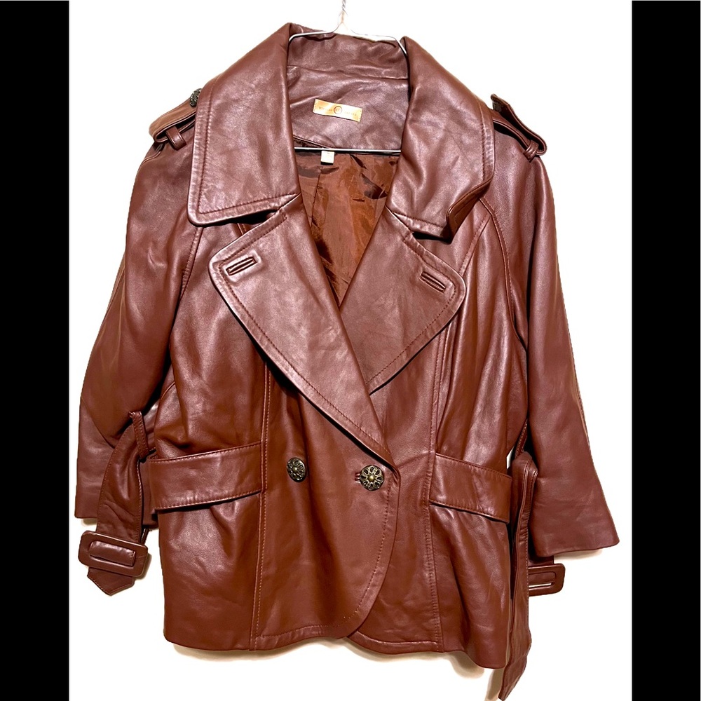 Brown Wilson’s brand leather jacket with cape sleeve